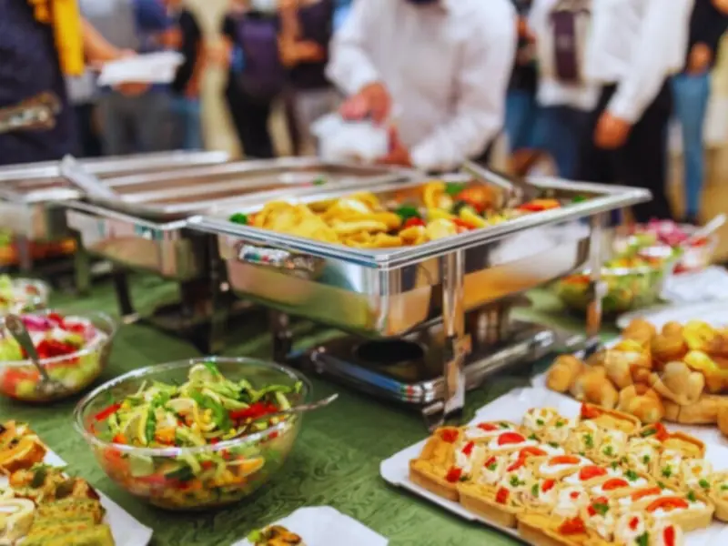 Function buffet with chafing dishes, salads and savoury snacks
